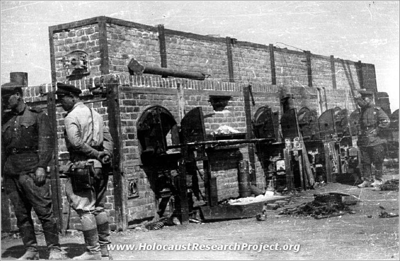 Soviet Red Army soldiers in the Majdanek camp upon its liberation, standing beside the camp's crematorium.